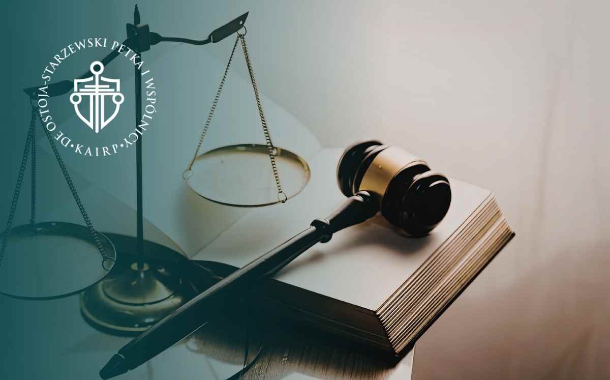Gavel and scales of justice on an open book, with a circular law firm logo in the upper left corner.