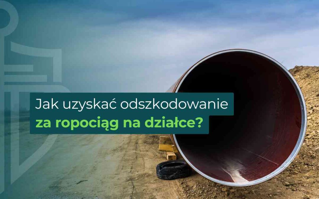 Open steel pipeline on a dirt construction site with bold Polish text about compensation for a pipeline on property.